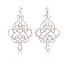 Pair of silver diamond earrings isolated on white