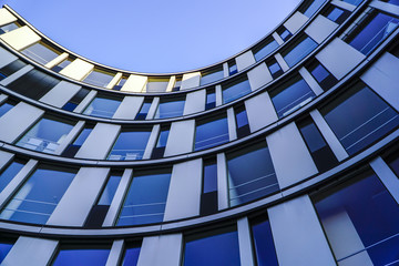 Low angle view of curved modern building facade