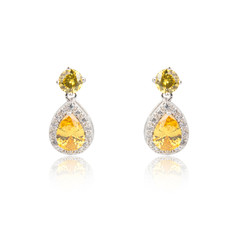 Pair of topaz diamond earrings isolated on white