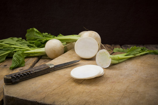 Sliced turnip on wooden board