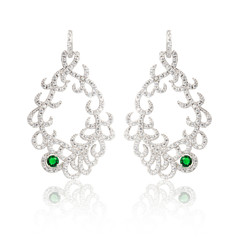 Pair of emerald earrings isolated on white