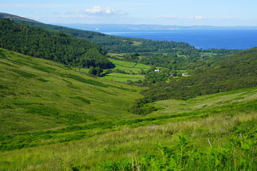 Scottish landscape with green rolling hills in the Isle of Arran, Scotland