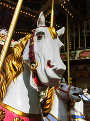 City colorful traditional french carousel for children, horse for riding