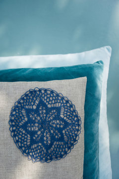 Cushion with applicated crochet tablecloth