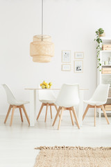 White chairs in bright room