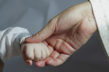 man holding a baby hand, New born baby hand