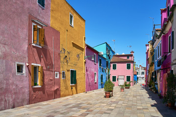 Fototapeta na wymiar Burano, Venice. Colorful houses architecture at the square. Summer 2017, Italy