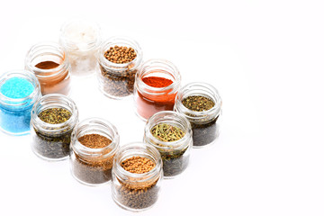 Set of seasoning making frame. Glass containers with spices