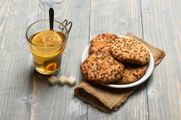 Drink and homemade goods concept. Biscuits with seeds