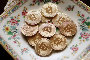 heap of shiny bitcoins close up