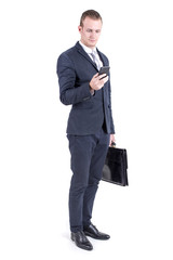 Businessman standing on white background and looking to smartphone, People with Business Concept, isolated on white background.