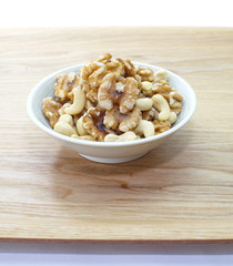 Assorted mixed nuts in white bowl