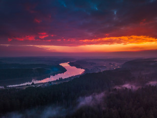 Aerial sunrise or sunset with colorful fog and river