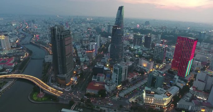 HO CHI MINH CITY, VIETNAM – MAY, 2016 : Aerial shot of central Ho Chi Minh cityscape at sunset with skyscraper and Saigon river in view