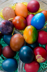colorful Easter eggs in basket  isolated, close up top view