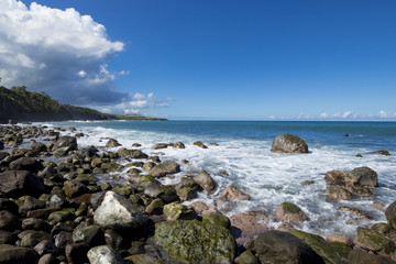 Fototapeta na wymiar Rocky unspoiled tropical beach on the island of St Kitts