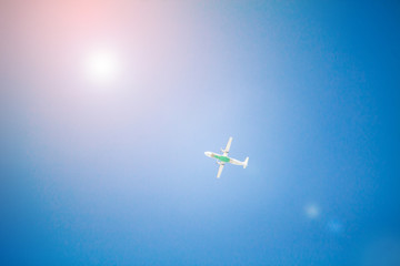 Naklejka na ściany i meble Airplane flying with blue sky