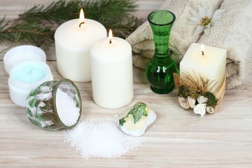 Obraz na płótnie Canvas Winter spa, aromatherapy treatmen, candles, bath crystals, towel, cream 