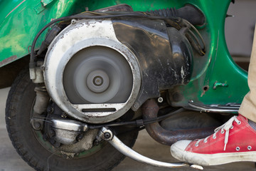 Kick Start A Very old Scooter with Two Stroke Engine And Ventilators Fan Spinning After Ignition.