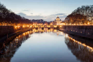 Fototapeta na wymiar Rome cityscape at sunset, tiber river, San Pietro and Sant'Angelo bridge.