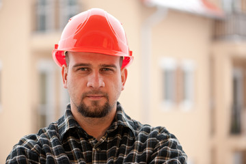 Man in construction helmet at the construction site