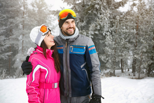 Skiers couple in love in mountain on skiing