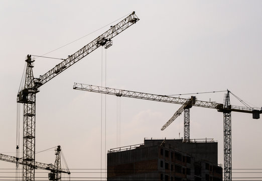 Construction site with cranes and building under construction