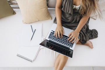 Woman working on laptop at home