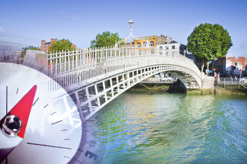 Discovery Republic of Ireland - concept image with a compass against the famous bridge in Dublin called "Half penny bridge"