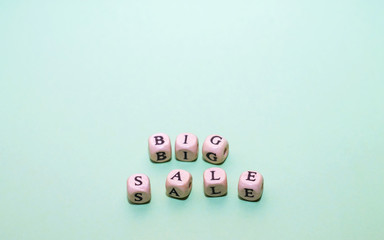 Word big sale from cubes on a green background