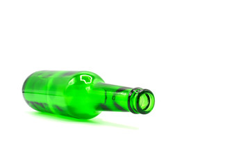 empty green glass bottle isolated on white background.