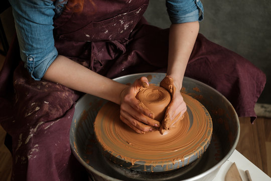 Woman Working On Pottery Wheel