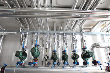 pump , manometer, pipes and faucet valves of heating system in a boiler room