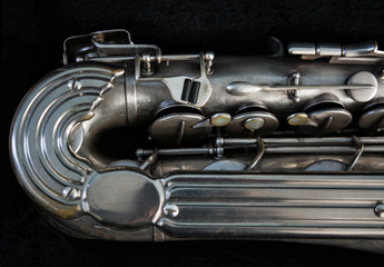 Silver saxophone in its case