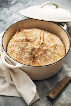 Food: Loaf of white wheat bread baked in an iron cast pot