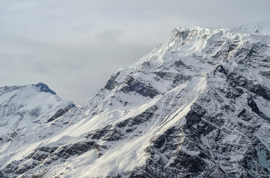Gorgeous Snowy Mountain Peak of Himalayas in a Dim Evening Light