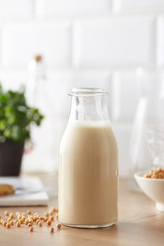 Jar of soy milk on kitchen table.