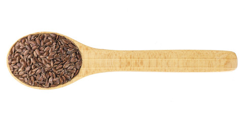 Flax seeds in wooden spoon isolated on white background close-up