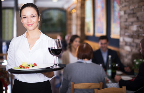 Waitress standing in restaurant