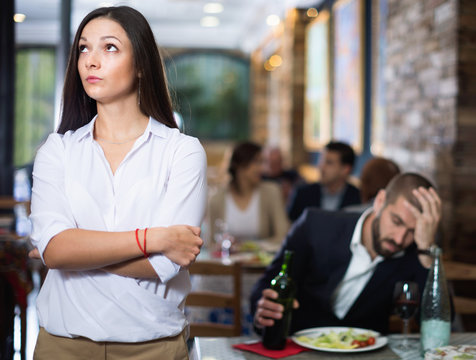 Portrait of upset man and woman in the restaurant on meeting
