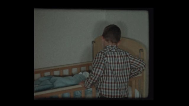 1959 7 year old boy sees newborn baby brother in crib for the 1st time