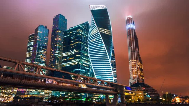 Zoom out Timelapse hyperlapse of Moscow city international business district at night