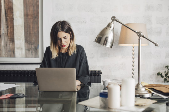 Businesswoman Typing on Laptop