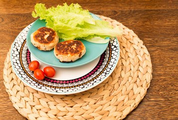 Juicy homemade cutlets (beef, pork, chicken) on a wooden background. The concept of a healthy diet.