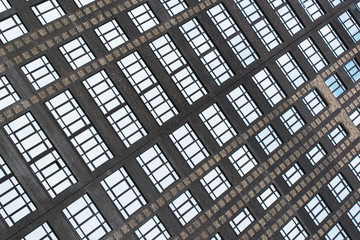 parallel lines of windows of a high-rise building