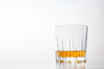 a glass of whiskey, Scotch, on a White isolated background