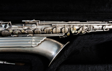 Silver saxophone in its case