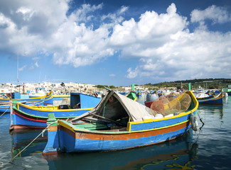 maltese traditional painted luzzu boats in marsaxlokk fishing village malta