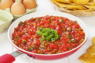 Mexican sauce salsa ranchera, made with onions, garlic, chilli, toasted cumin seeds, Mexican oregano, green peppers and tomatoes. Delicious with fried eggs and corn chips.