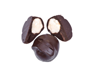 Dark chocolate covered  macadamia nuts isolated on white background